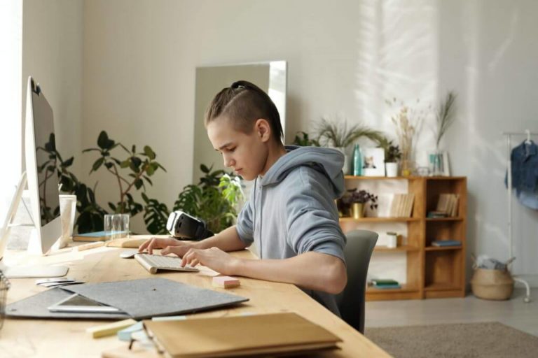 boy in gray hoodie sitting on black chair 4144526 scaled 1 1024x683 1